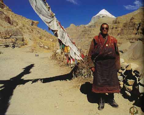
Pilgrim at Tarboche with Kailash behind - The Rivers of the Mandala: Journey to the Heart of Buddhism book
